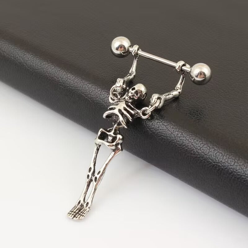 Side view of vintage punk skeleton dangle nipple ring highlighting the detailed skeleton charm craftsmanship.