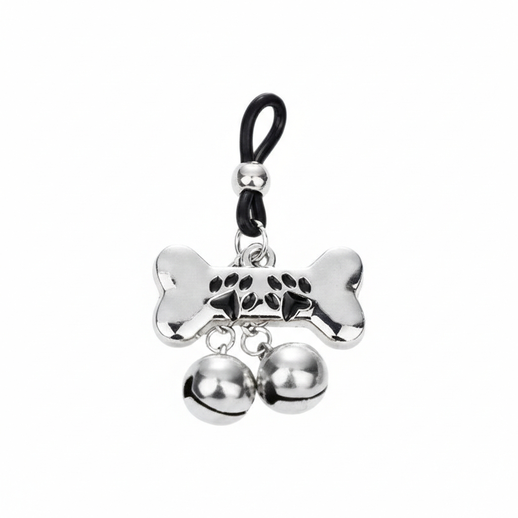 Single weighted nipple loop featuring a bone charm with paw prints and twin jingle bells.