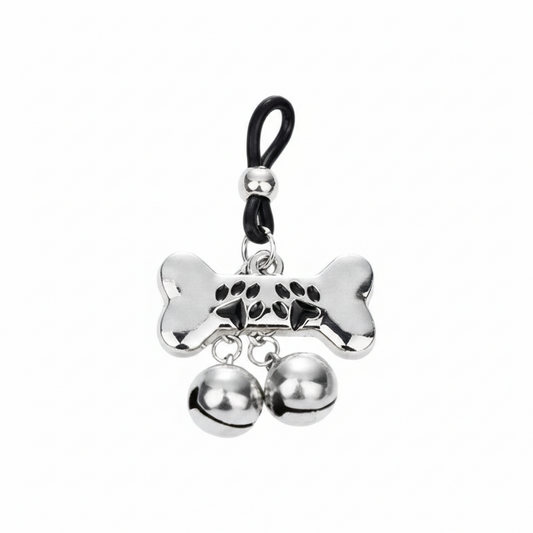 Single weighted nipple loop featuring a bone charm with paw prints and twin jingle bells.