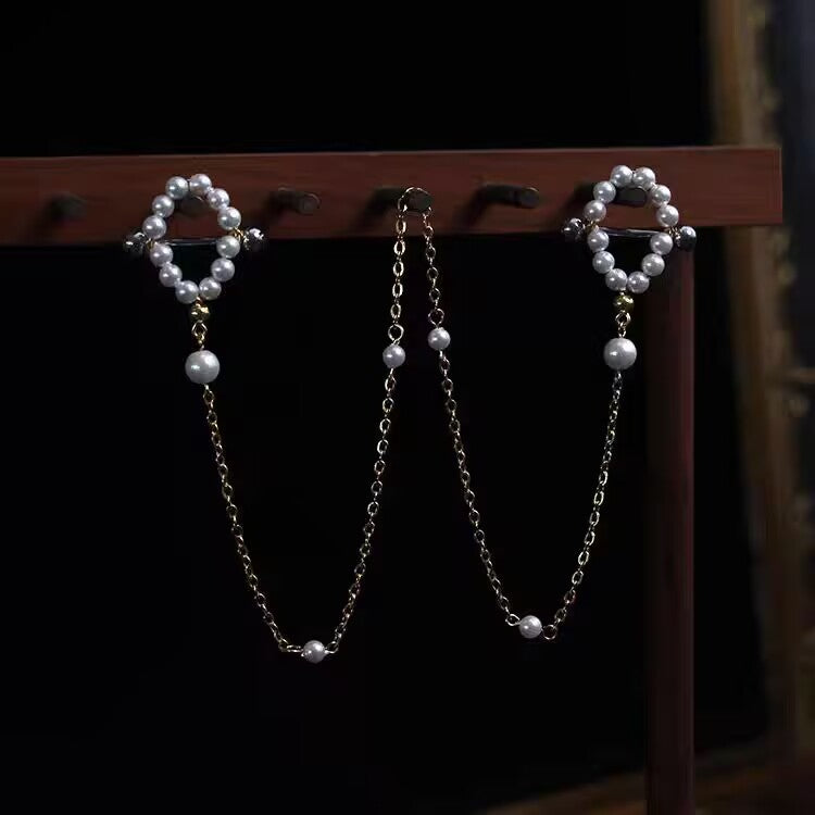Complete white pearl nipple chain body jewelry set with connected center chain.