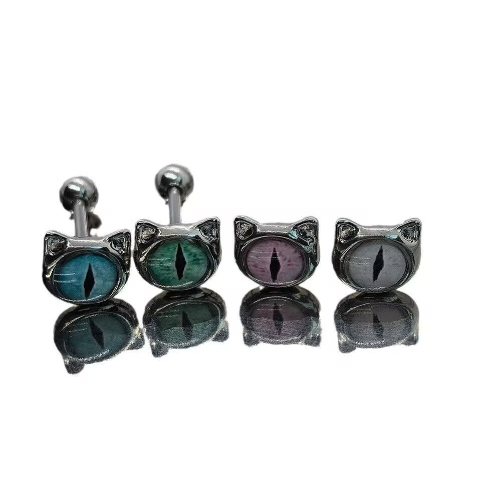 Close-up view of four cat eye tongue barbells with vertical pupil designs in vibrant colors on a pure white background.