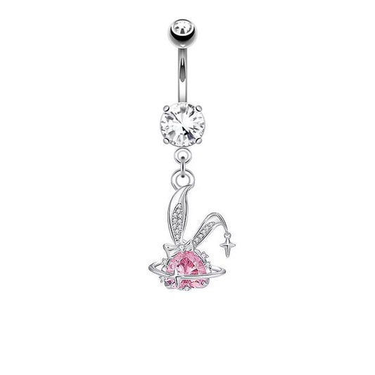Front view of a silver dangling belly button ring featuring sparkly rhinestone bunny ears and a pink crystal heart planet Saturn charm with a star.