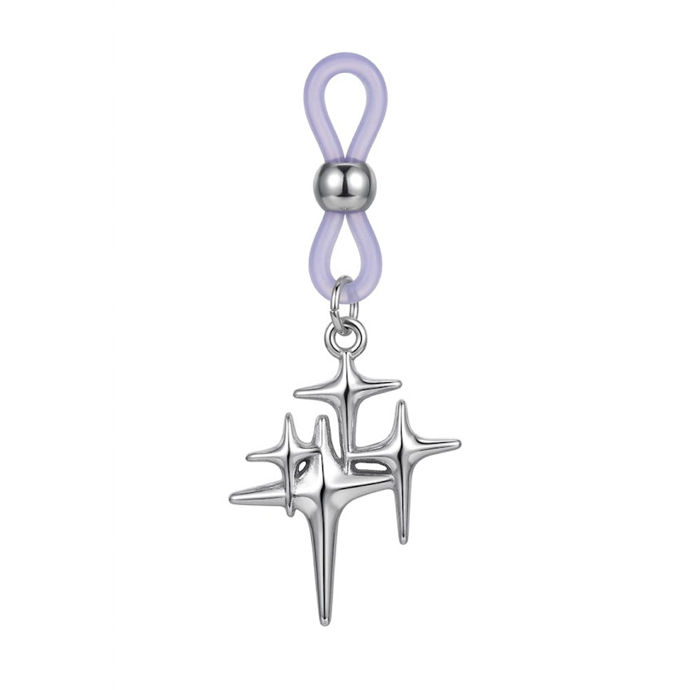 A single non-piercing nipple ring featuring an adjustable purple silicone loop with a silver metal slide bead and a hanging Y2K cyber celestial starburst charm with a high-polish finish.
