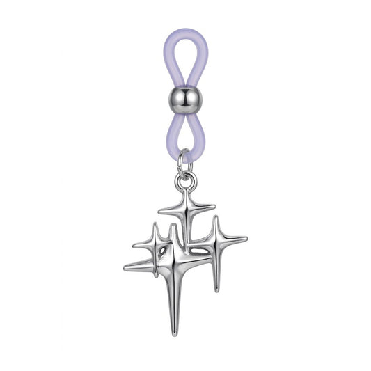 A single non-piercing nipple ring featuring an adjustable purple silicone loop with a silver metal slide bead and a hanging Y2K cyber celestial starburst charm with a high-polish finish.